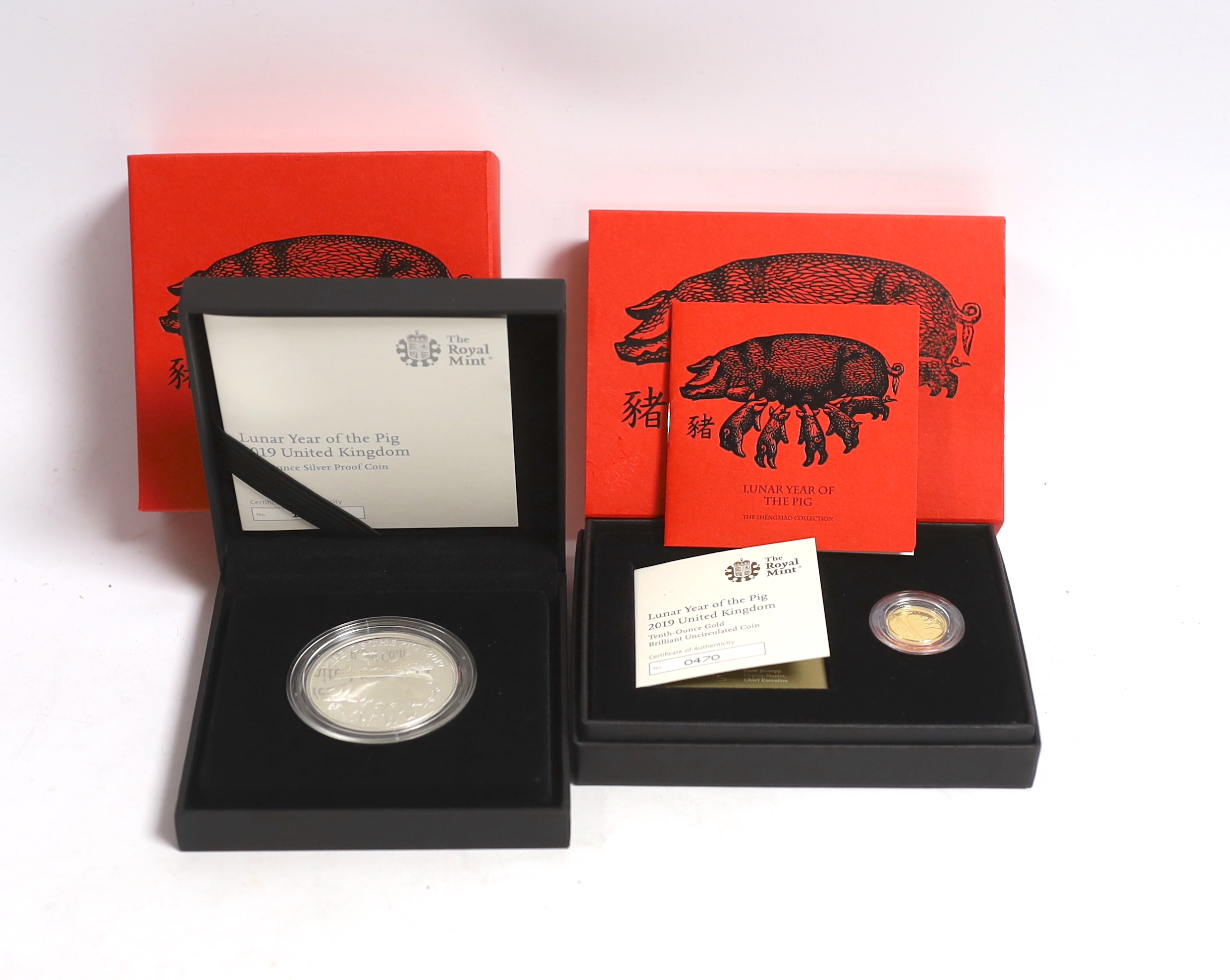 Royal Mint Lunar Year of the Pig, 2019, one tenth oz gold BUNC coin and one oz silver proof coin (two cases).